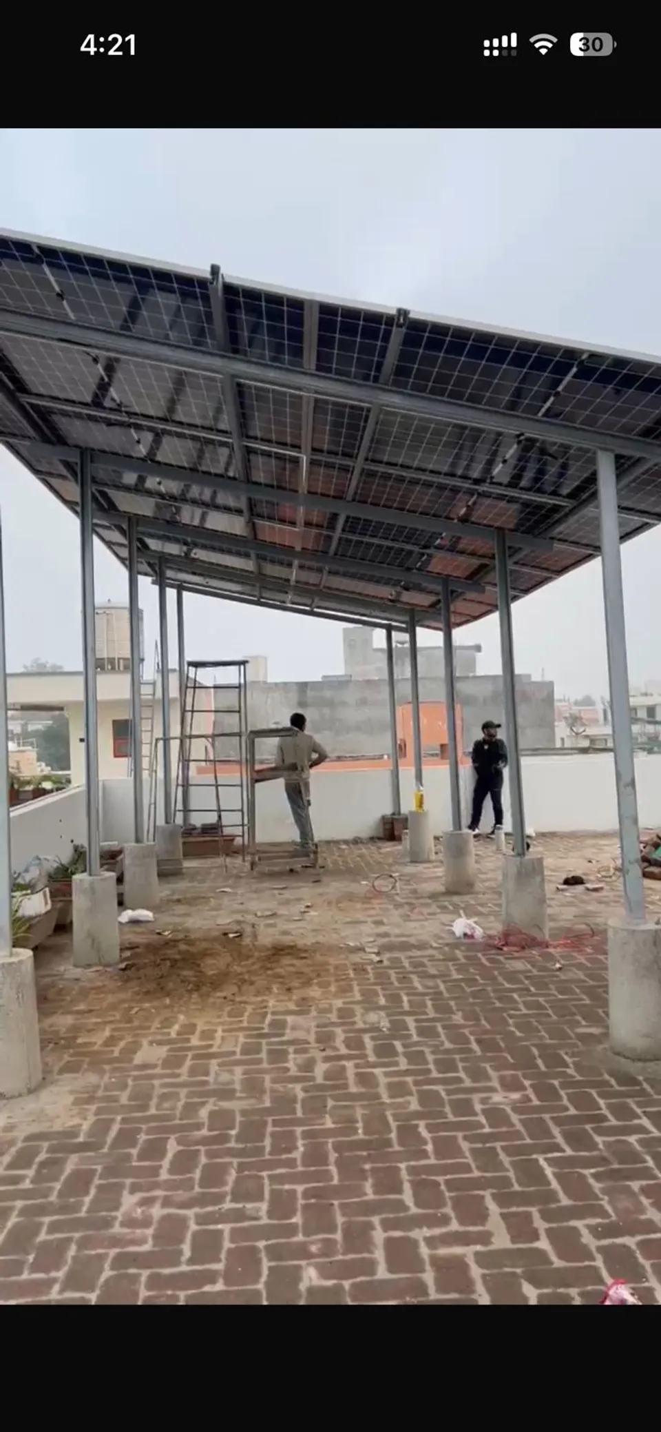 Rooftop solar mounting structure and panels during installation